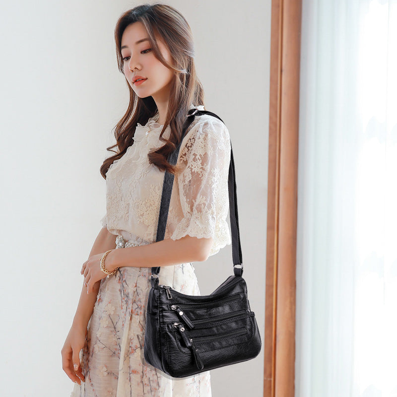 2025-ös új divatos, nagy kapacitású válltáska, többrétegű női hátizsák, könnyű és egyszerű, puha bőrből készült messenger táska