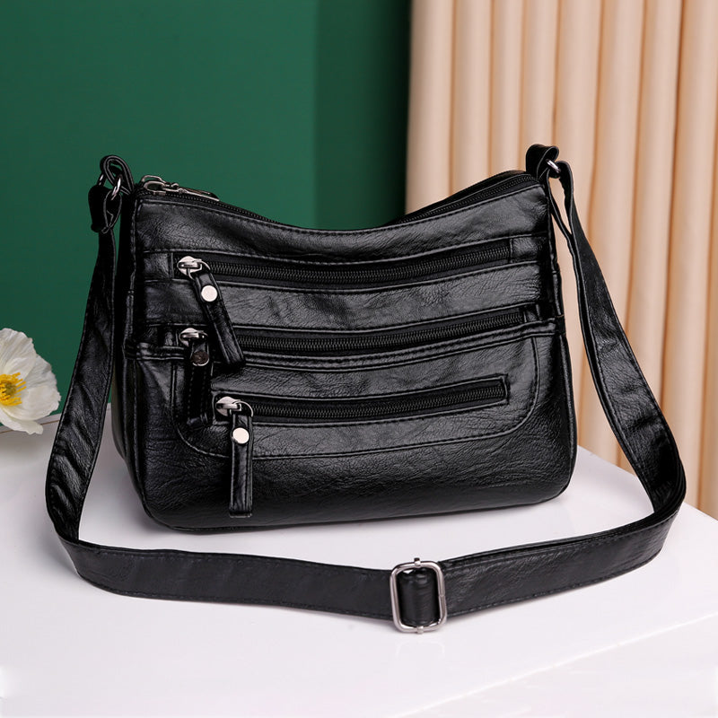2025-ös új divatos, nagy kapacitású válltáska, többrétegű női hátizsák, könnyű és egyszerű, puha bőrből készült messenger táska