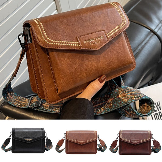 👜👜Nový štýl 2026, široký ramenný popruh, malá kožená taška s veľkou kapacitou. Retro crossbody malá štvorcová kabelka