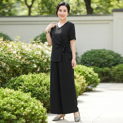 👚【43-105kg】Nowy, dopasowany garnitur z dekoltem w serek, stylowy perłowy design, falbany w kształcie muszki wyszczuplające i ukrywające brzuszek, wygodny i przewiewny.