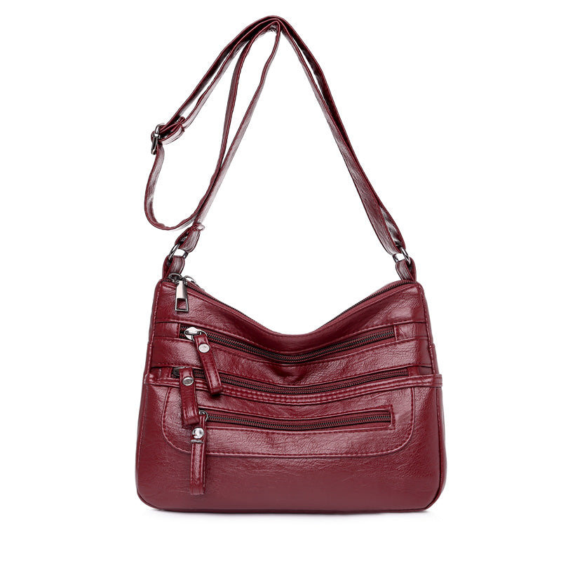 2025-ös új divatos, nagy kapacitású válltáska, többrétegű női hátizsák, könnyű és egyszerű, puha bőrből készült messenger táska