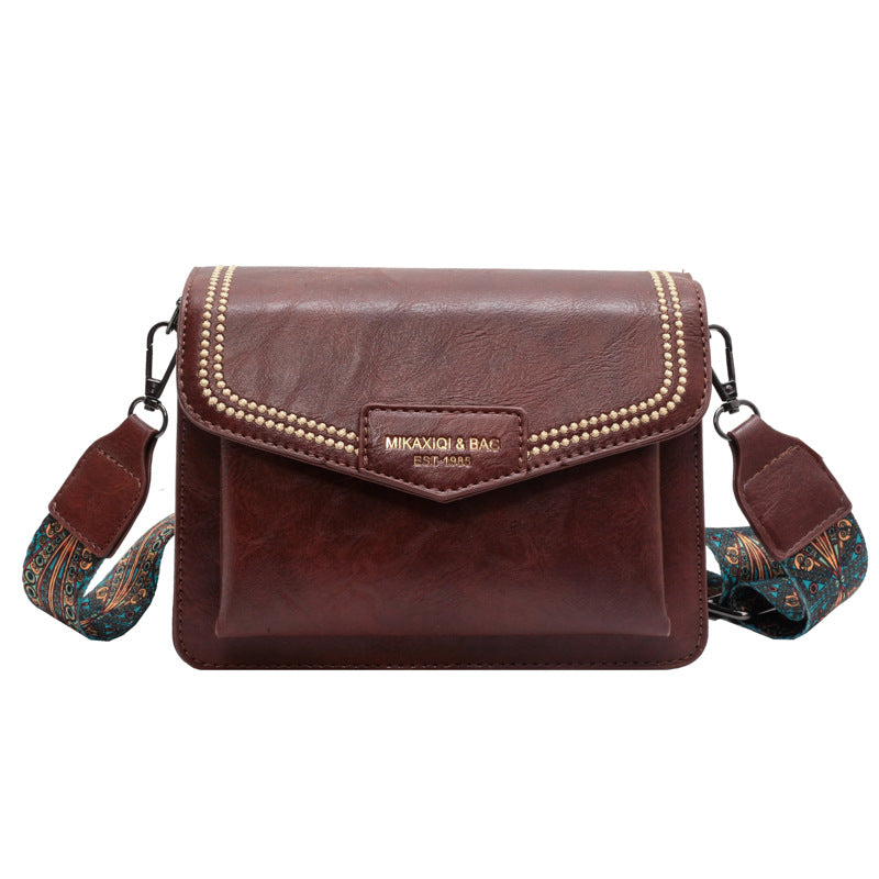 👜👜Nový štýl 2026, široký ramenný popruh, malá kožená taška s veľkou kapacitou. Retro crossbody malá štvorcová kabelka